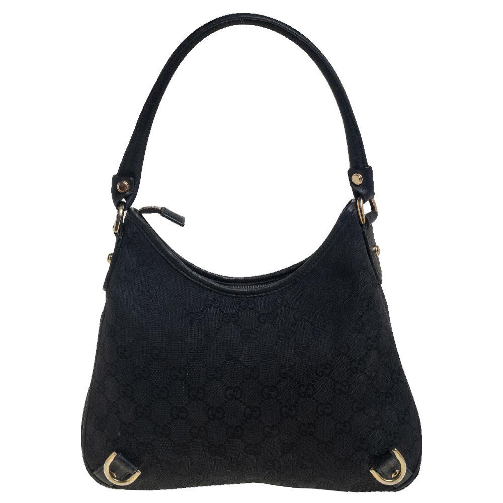 Gucci brings to you this amazing Abbey D-Ring hobo that is a classic. Made in Italy, this black bag is crafted from GG-coated canvas and features a leather handle. It opens to a fabric-lined interior with enough space to hold all your daily