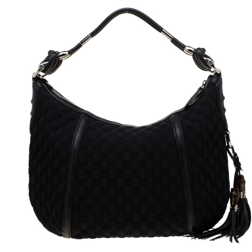 Looking for a stylish bag? You cannot go wrong with Gucci! Smoothly glide from day to night with this versatile Techno Horsebit bag that offers a stunning design, being crafted from black fabric. The insides are lined with nylon that has a lovely