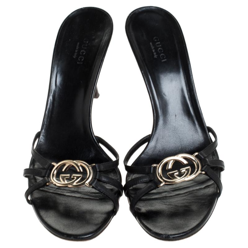 These Gucci slides can be your latest loved purchase. These have been crafted out of leather and detailed with the brand's GG logo on the uppers. The insoles are leather-lined and the 8 cm heels will give you the right lift.

Includes: The Luxury