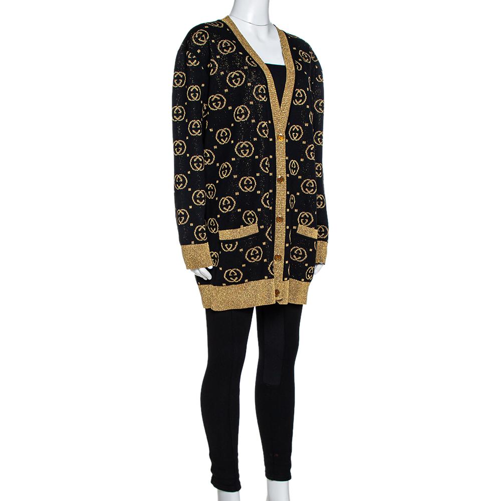This cardigan from Gucci is well-made and absolutely gorgeous. In gorgeous black and gold hues, this cardigan features the signature GG Supreme print all over, long sleeves, and GG button fastenings. Knit to perfection, this piece is wonderful