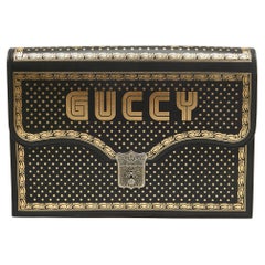 Used Gucci Black/Gold Leather Printed GUCCY Portfolio Clutch