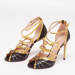 Gucci Schwarz/Gold Leder Tigerkopf Riemchensandalen Größe 36