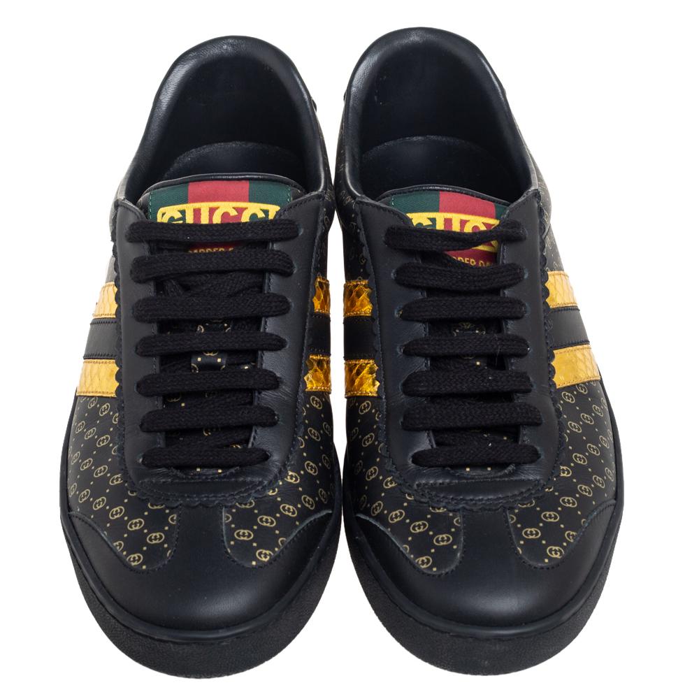 These black/gold sneakers from Gucci are perfect for days when you wish for comfort and style! The Dapper Dan sneakers are crafted from leather and feature round toes, lace-ups on the vamps, and tough rubber soles. They are finished with logo