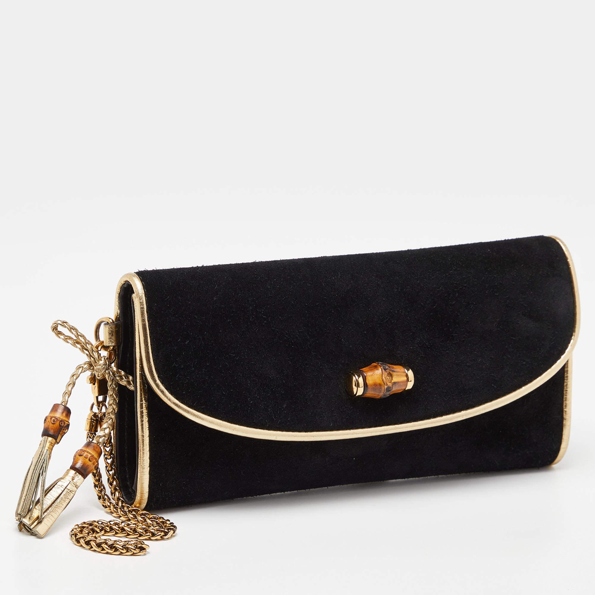 This Gucci black/gold clutch for women has the kind of design that ensures high appeal, whether held in your hand or tucked under your arm. It is a meticulously crafted piece bound to last a long time.

