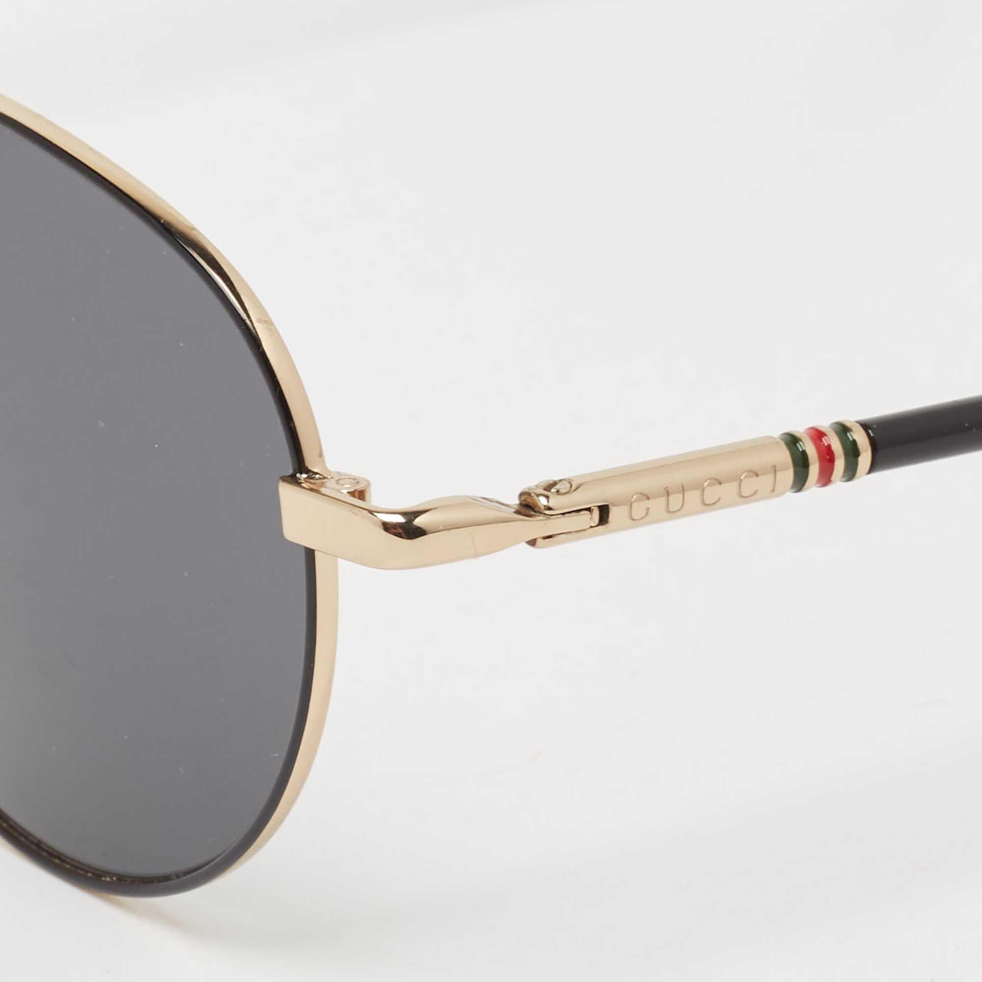 Embrace sunny days in full style with help from this pair of sunglasses by Gucci. Created with expertise, the luxe sunglasses feature a well-designed frame and high-grade lenses that are equipped to protect your eyes.