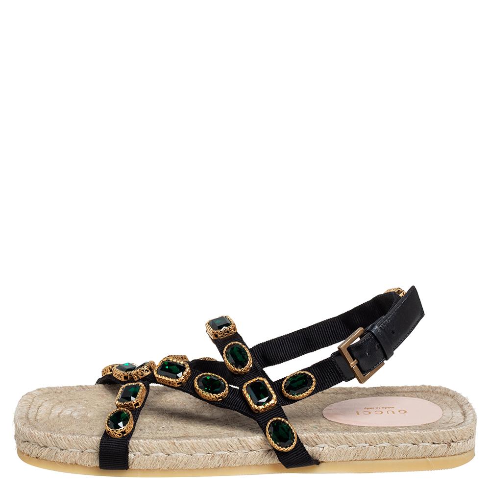 This beautiful pair of Canvas sandals will bring out the fashion diva in you. Looking glamorous in your casuals is as easy as slipping on these gorgeous rubber sole sandals. These sandals from Gucci are one of a kind in trendy women's footwear. You