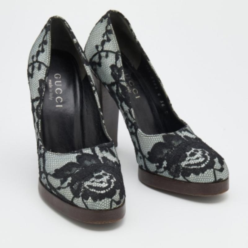 Stay comfortable throughout your day in these lovely pumps from Gucci. The floral lace & satin upper takes the form of covered toes and is mounted on a leather base and block heels.