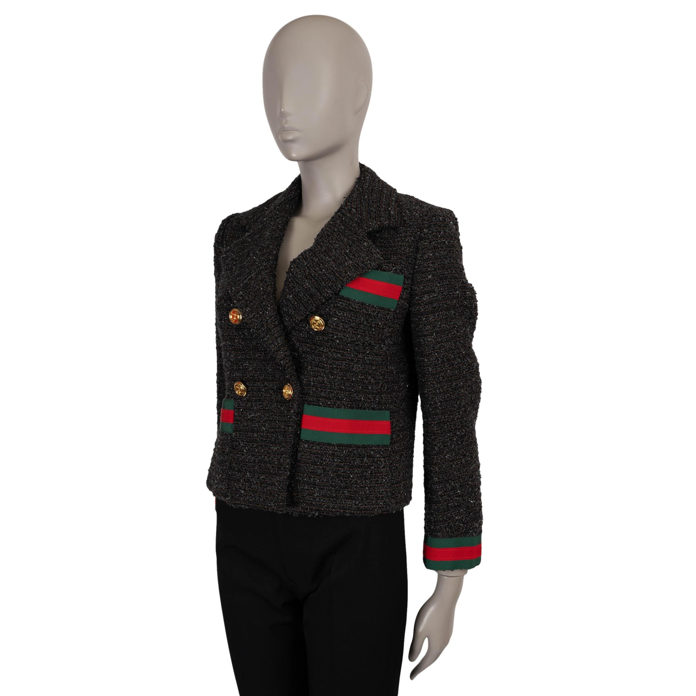Gucci blazer in black, grey and taupe cotton (37%), viscose (16%), polyester (14%), wool (11%), polyamide (10%), acrylic (10%), and silk (2%). Features a fitted, cropped silhouette, wide peak lapel, a chest pocket and two open pockets at the waist