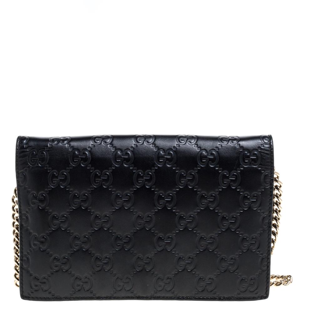 Designed to perfection and crafted from Guccissima leather, this wallet on chain can be your go-to accessory. Bringing elegance and class to your style, this classic black-hued wallet from Gucci is stylish and convenient. It is finished with a long