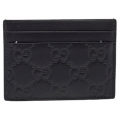 Gucci - Porte-cartes en cuir noir Guccissima