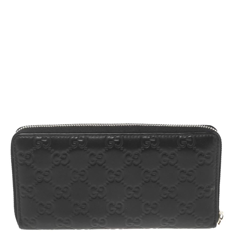The durable leather construction and the classy details of this wallet make it a reliable accessory. This fine wallet features a black exterior with Guccissima embossing and a gold-tone zipper to secure the well-equipped interior. This Gucci