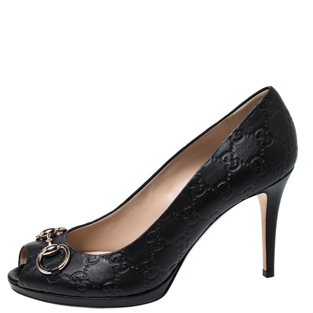 Grace and poise will all come naturally to you when you step out in this pair of black pumps from Gucci. Crafted from Guccissima leather, the peep-toe pumps have been styled with comfortable insoles, 10 cm heels and the iconic Horsebit detail on the