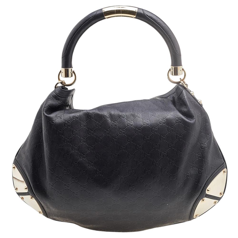 This Gucci Babouska Indy creation might just become the most loved classic bag in your closet. Crafted from Guccissima leather, it has gold-tone metal accents all over and the signature tassel detail at the front. The bag is equipped with a single