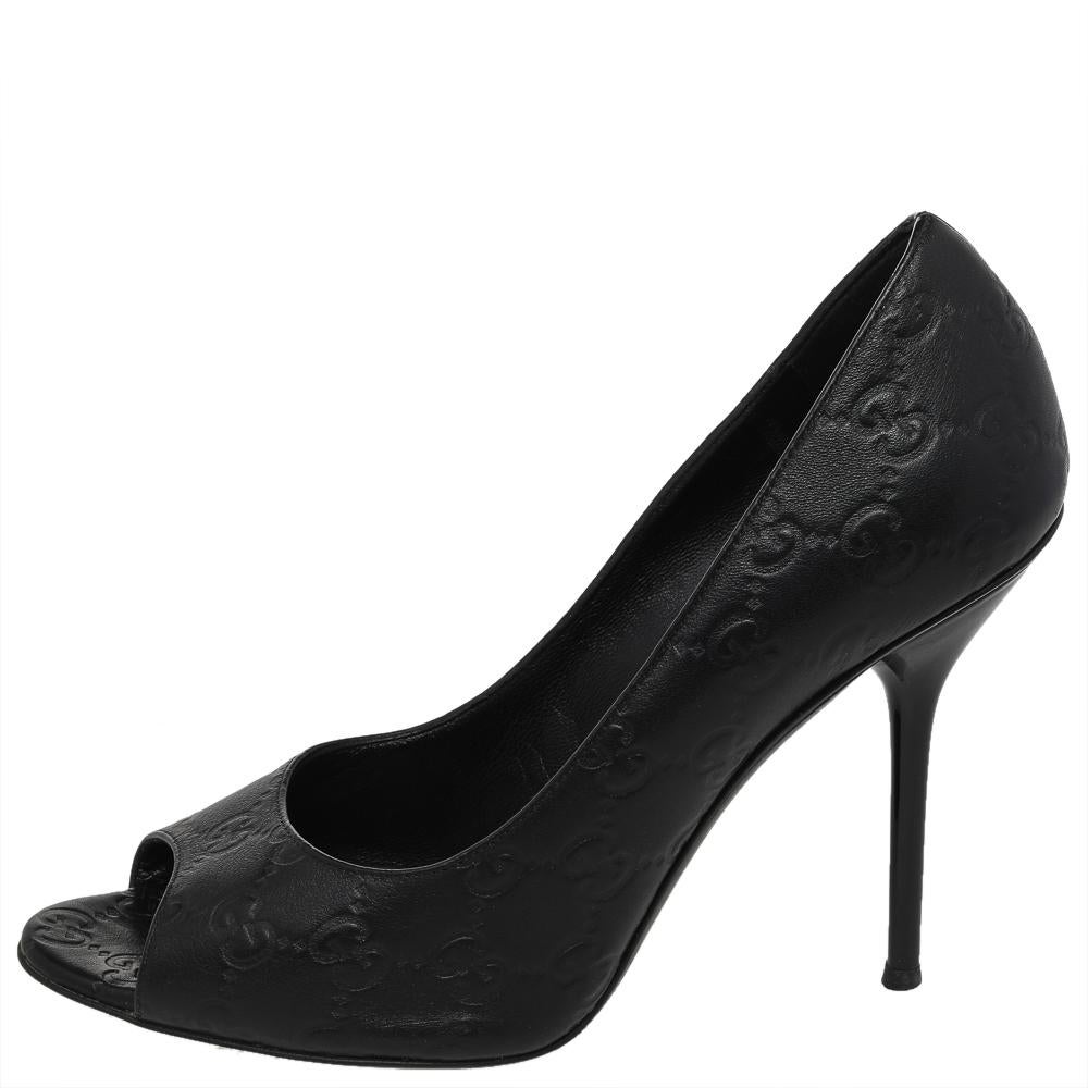 Look chic and make an elegant style statement in this pair of Guccissima leather pumps. These elegant Gucci pumps are your favorite go-to option for any special occasion. The plush design of these classic black pumps, including peep toes and high