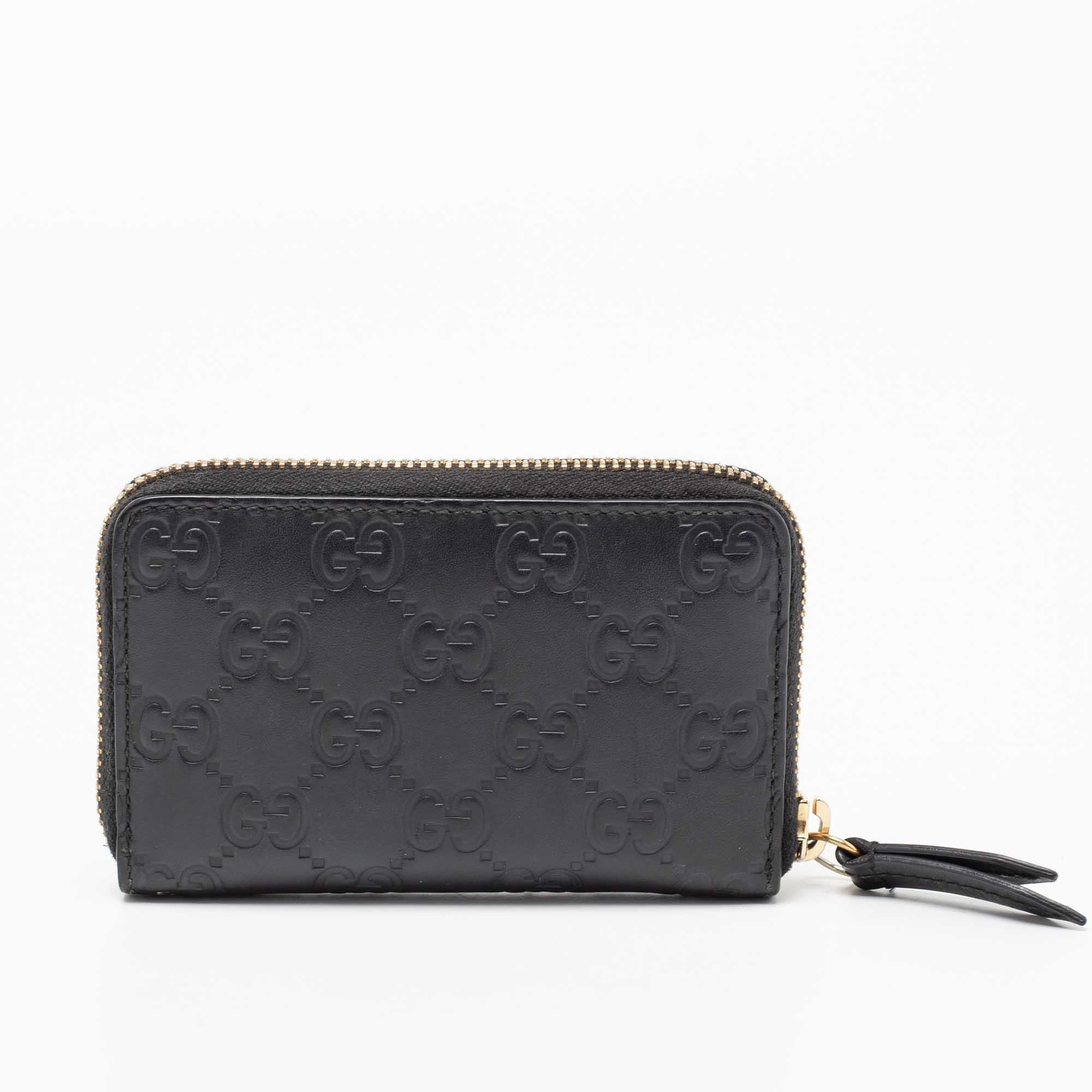 To store all your currencies and cards, this card case from the House of Gucci is the best accessory to trust. It is created using black Guccissima leather and features a zip-around that opens to a leather-lined interior. Gold-tone hardware adds a