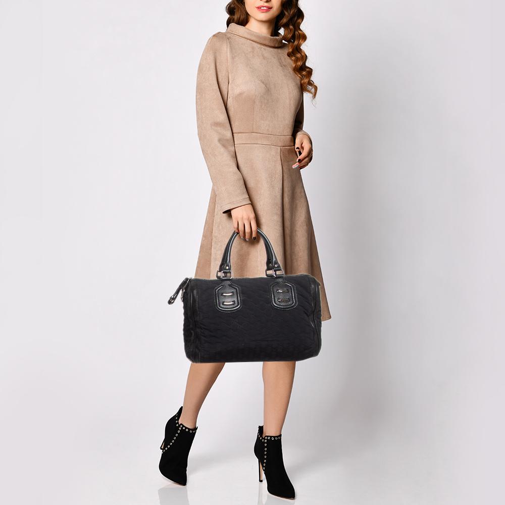 Grab this stunning Boston bag from Gucci. Crafted in Italy, it is made with Guccissima neoprene and leather and comes in a classy shade of black. You will find this bag an ideal companion for all your needs. The interior is lined with nylon and is