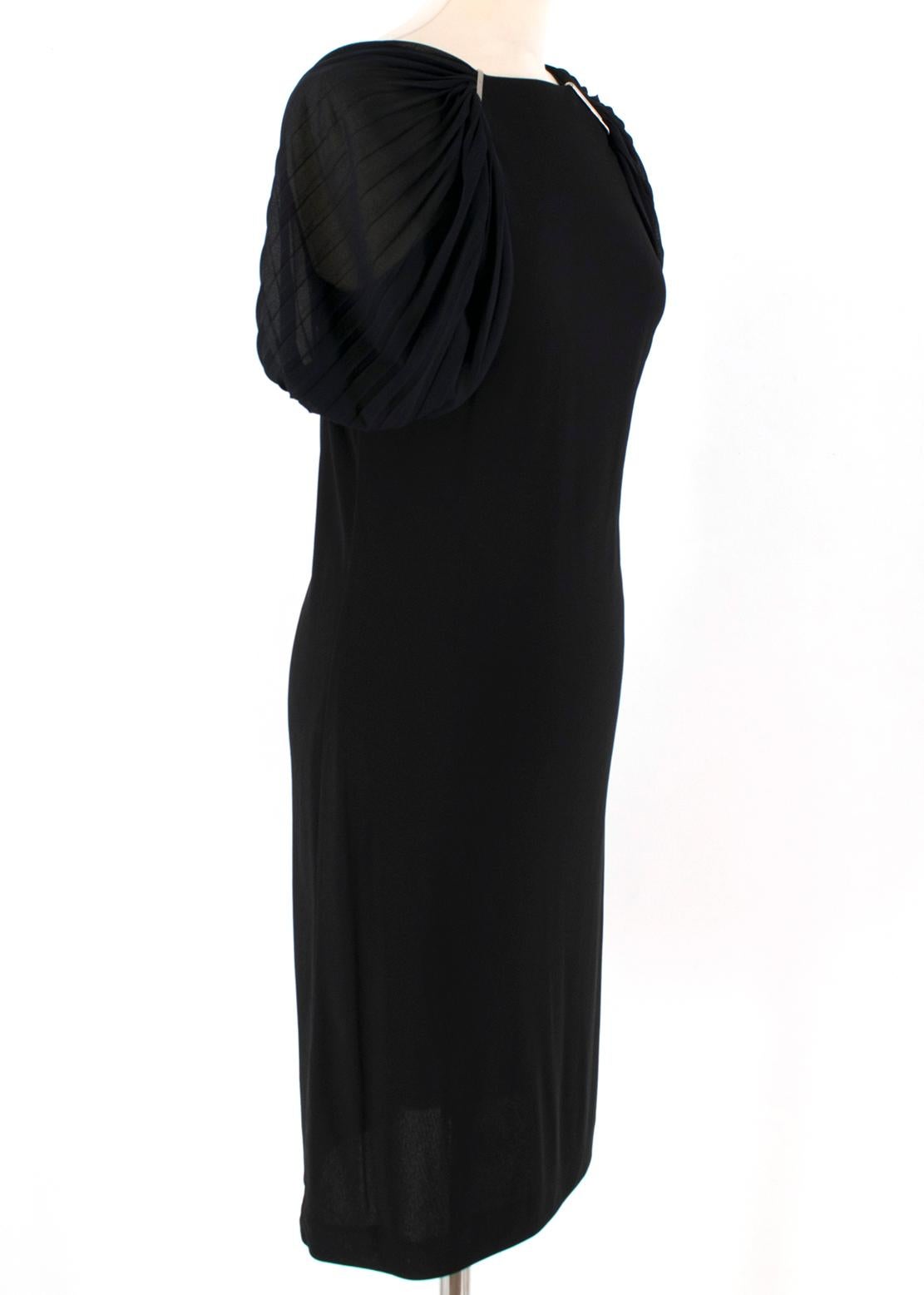 Gucci Black Viscose Dress

- Black viscose dress
- Lightweight
- Pleated chiffon shoulder straps, drape sleeve
- Square neckline
- Centre-back zip fastening

Please note, these items are pre-owned and may show some signs of storage, even when unworn