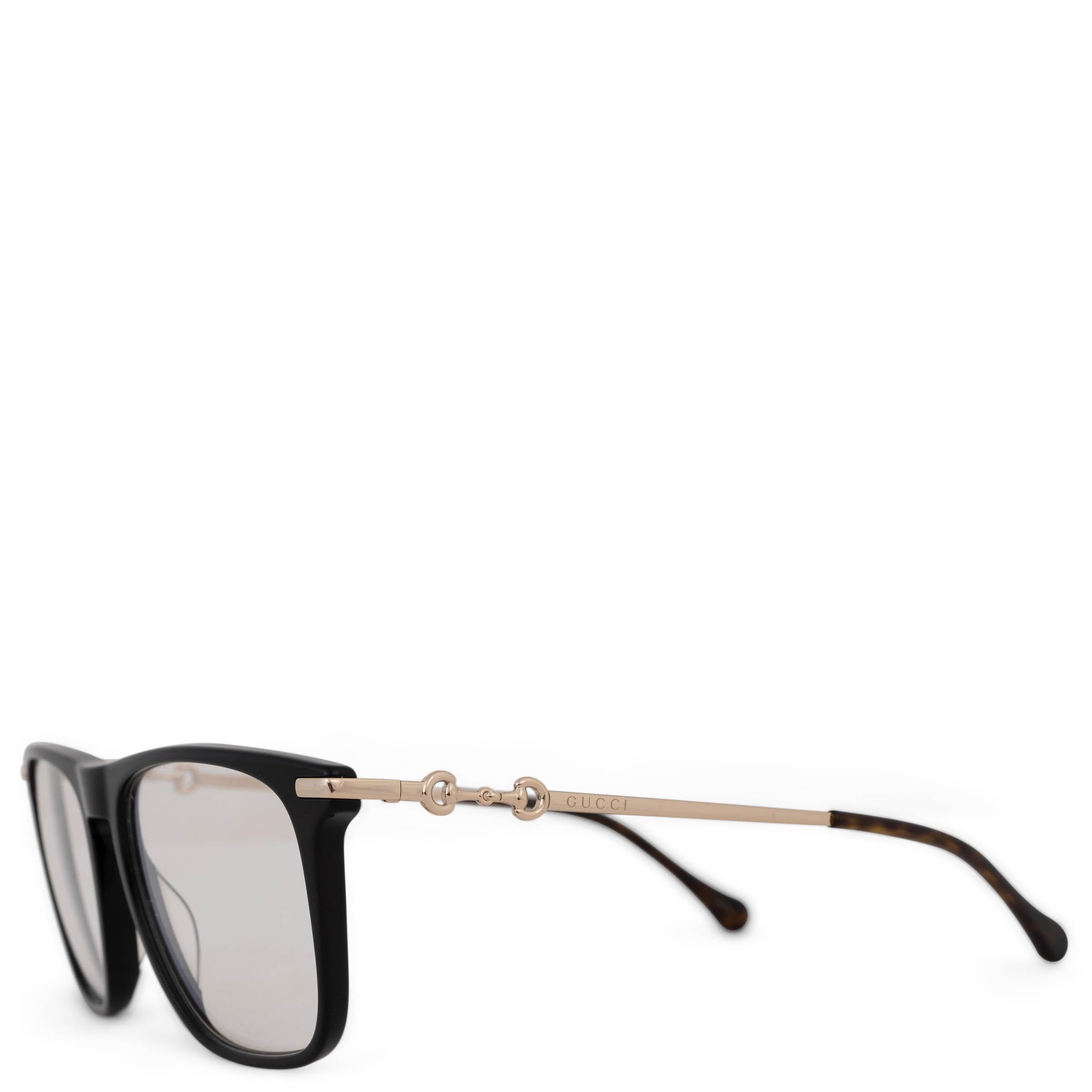 This 100% authentic Gucci rectangular sunglasses in black acetate offer a sleek, modern aesthetic. Featuring photochromic lenses that adjust to light, they are accented with gold-tone metal temples adorned with the signature horsebit detail and