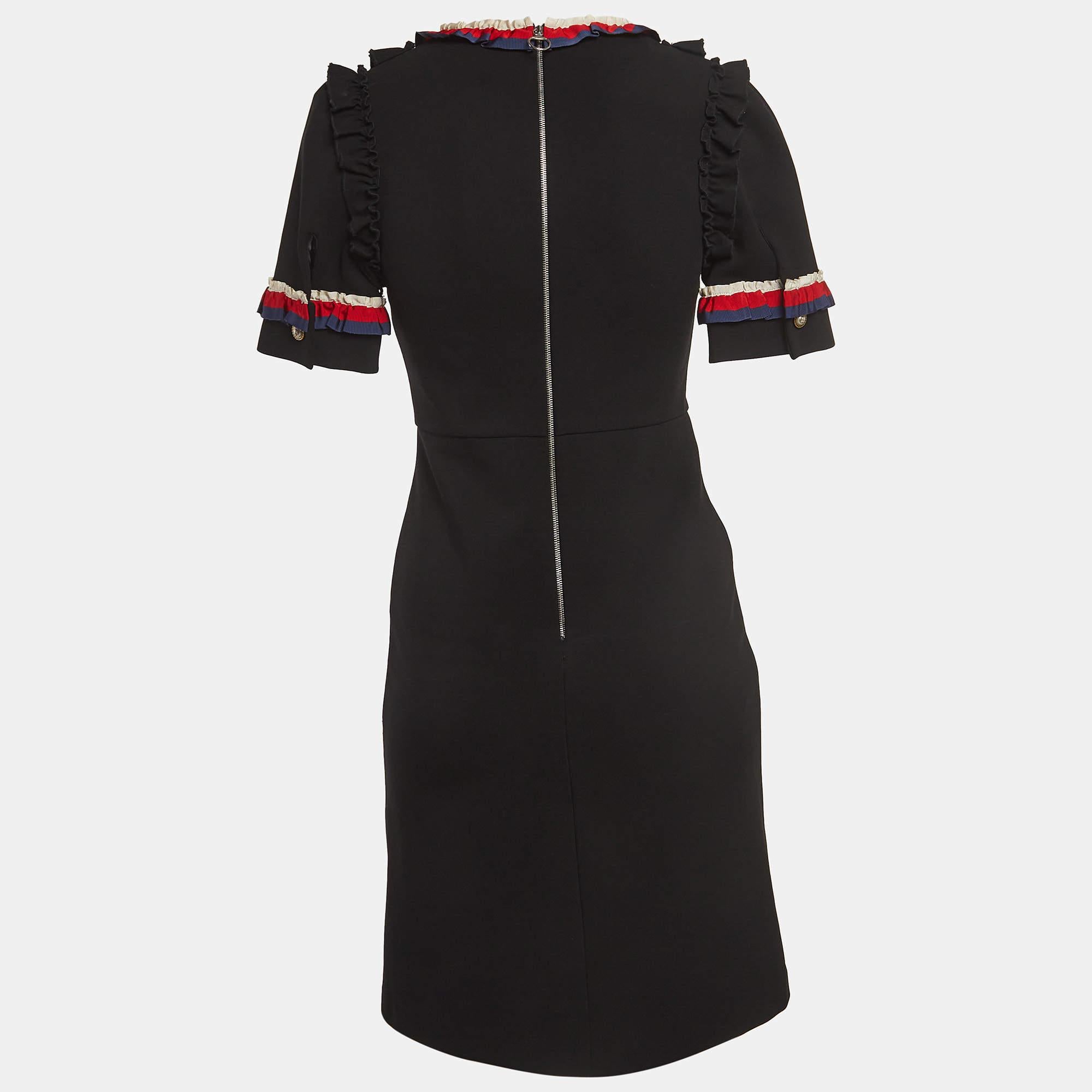 Elevate your style with the Gucci dress. Crafted with meticulous attention to detail, this exquisite piece features elegant ruffles and signature web trim accents. Effortlessly chic, it exudes confidence and charm, making it a timeless addition to