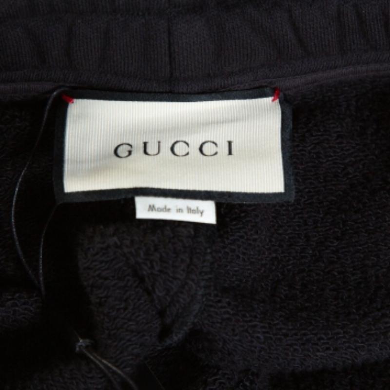 Schwarze Gucci-Strick-Traghose mit kontrastierendem vertikalem Logodruck und Logodruck M im Angebot 1