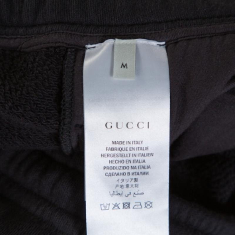 Schwarze Gucci-Strick-Traghose mit kontrastierendem vertikalem Logodruck und Logodruck M im Angebot 2