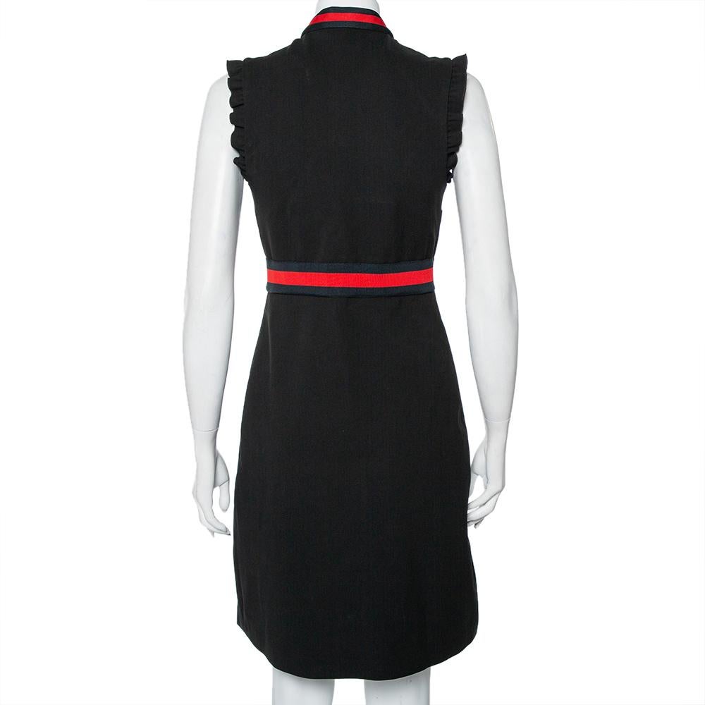 Show your love for contemporary fashion by donning this extravagant dress from Gucci. It comes made from quality fabrics with ruffled details and a flattering silhouette. The front long zip closure and the signature Web stripe trim detailing add to