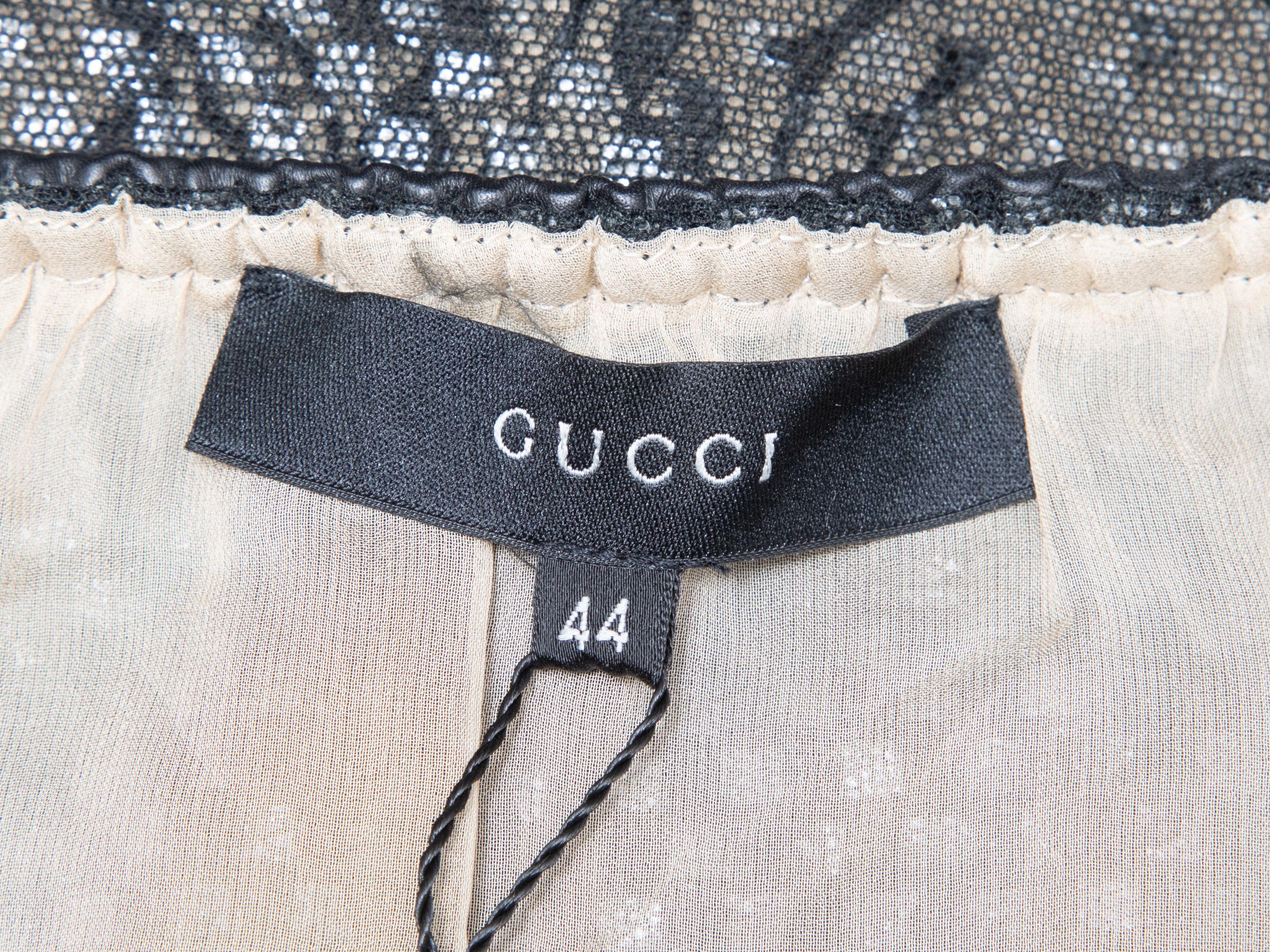 Product Details: Vintage black layered lace mini skirt by Gucci. Elasticized waistband. Designer size 44. 31