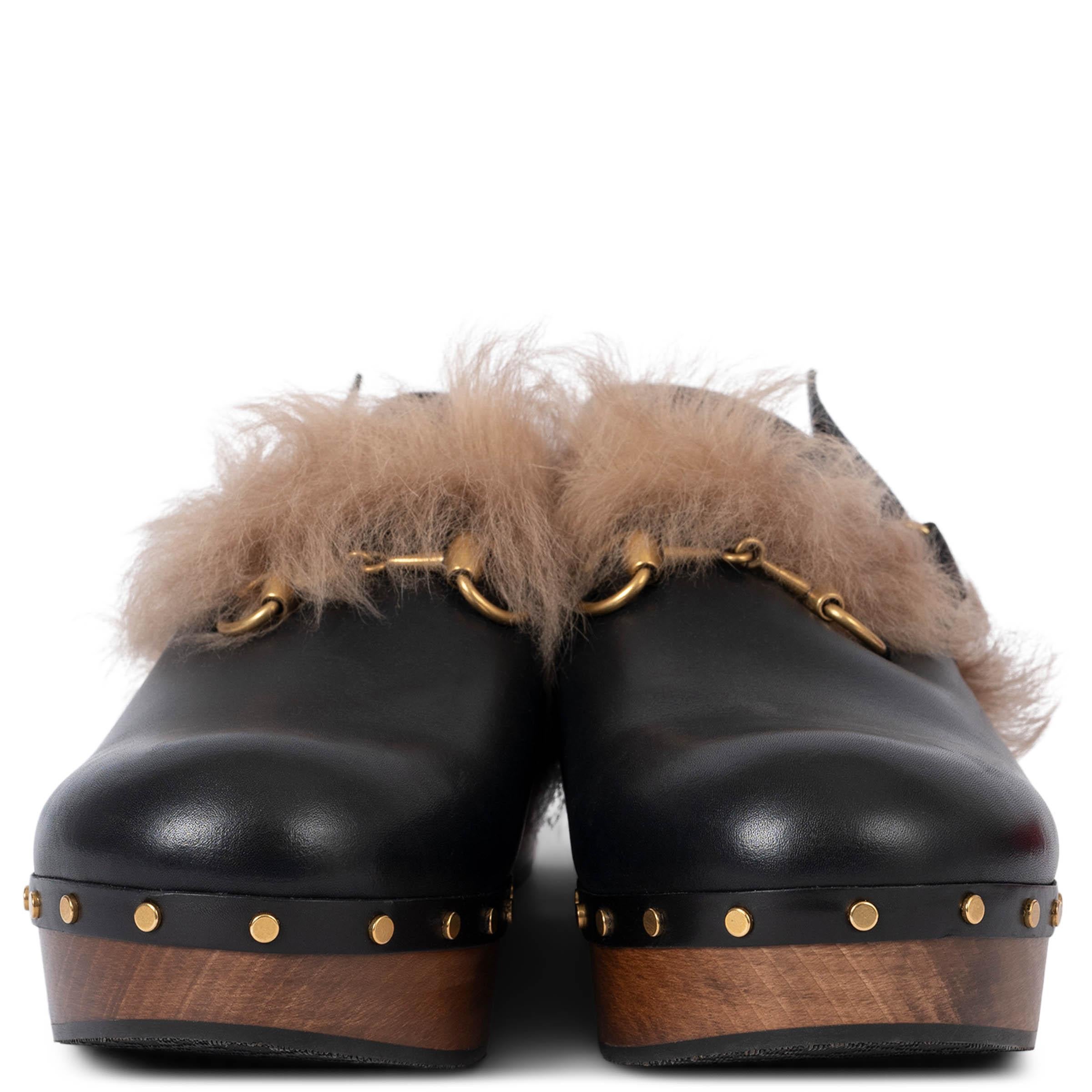 100% authentic Gucci 2015 Amstel kangaroo fur lined black clogs featuring a round toe, antique gold-tone horsebit detail and stud detailing on the side. The design features an adjustable velcro fastening. Brand new. 

Measurements
Imprinted