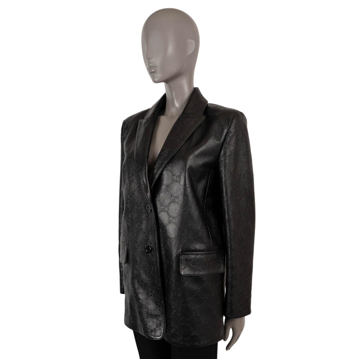 100% authentic Gucci blazer in black clafskin leather (100%) with GG embossing. Features notched lapels and two flap pockets at the waist. Closes with black metal buttons and is lined in viscose (57%) and polyester (43%). Has been worn and is in