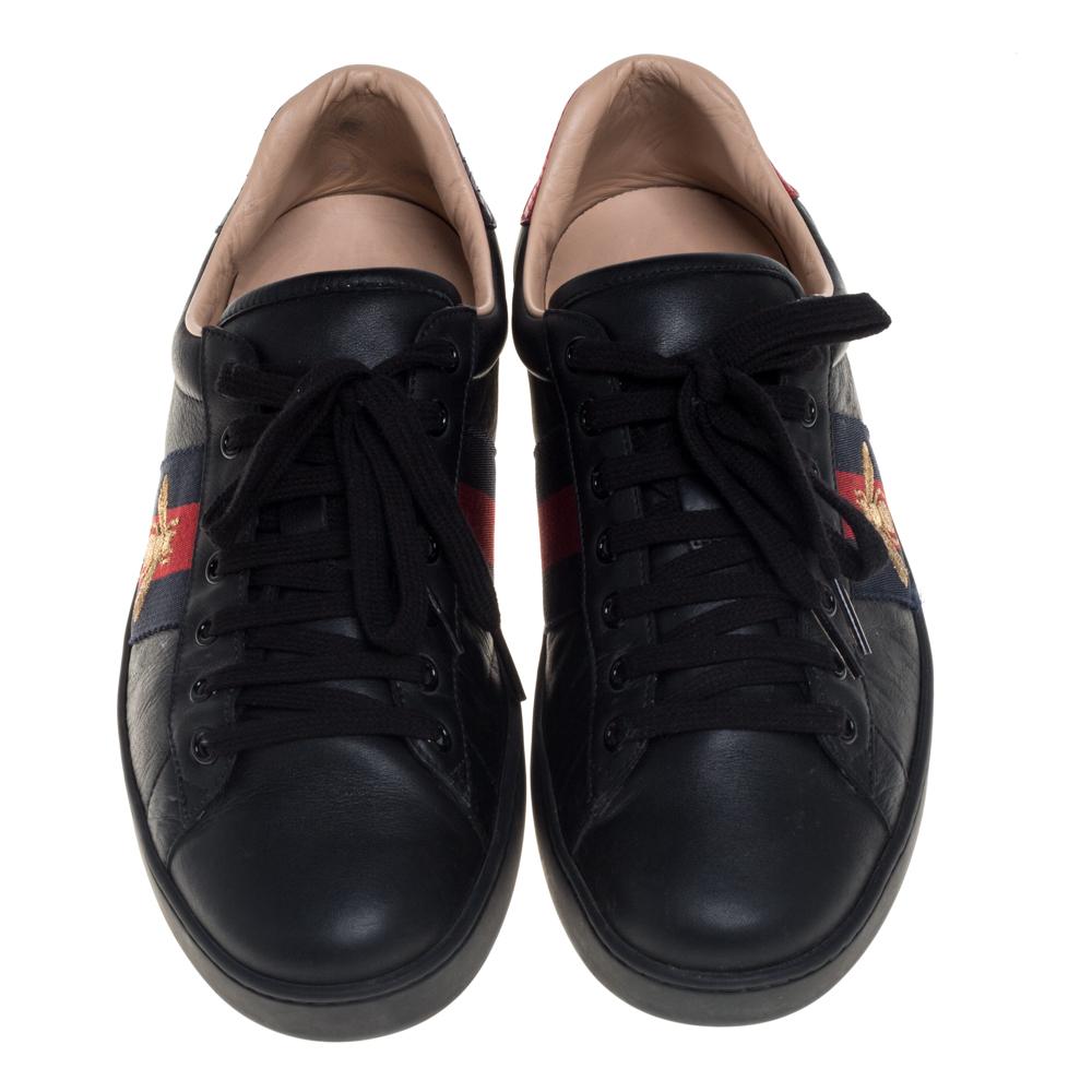 Stacked with signature details, this Gucci pair is rendered in leather and is designed in a low-cut style with lace-up vamps. The black sneakers have been fashioned with the iconic web stripes and embroidered bee motifs on the sides. Complete with