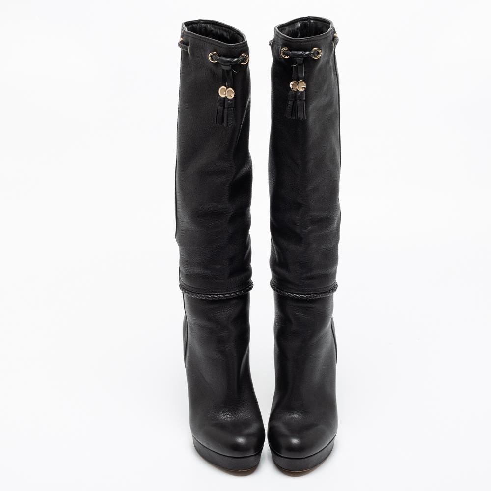 Gucci brings you this fabulous pair of knee-high boots that will give you comfort and loads of style. They've been crafted from leather in a classy black shade and finished with platforms and 11.5 cm heels bound to lift you with beauty.