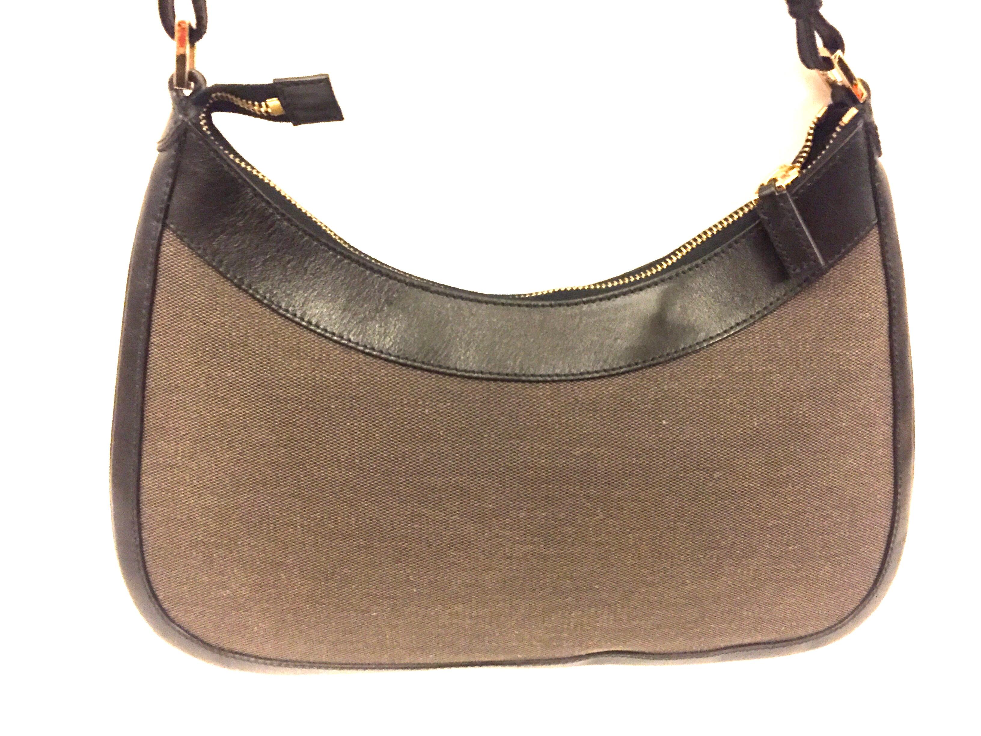 Black Gucci black leather and brown canvas hobo style bag