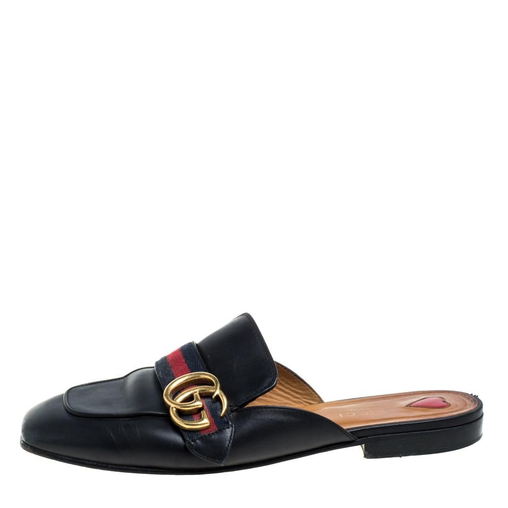 These Gucci Princetown mules are a fresh update on the perennially chic Gucci Horsebit loafers. They are enhanced by the signature GG motif and the Web stripe defined by the Gucci collection from the very beginning. Featuring a leather and canvas