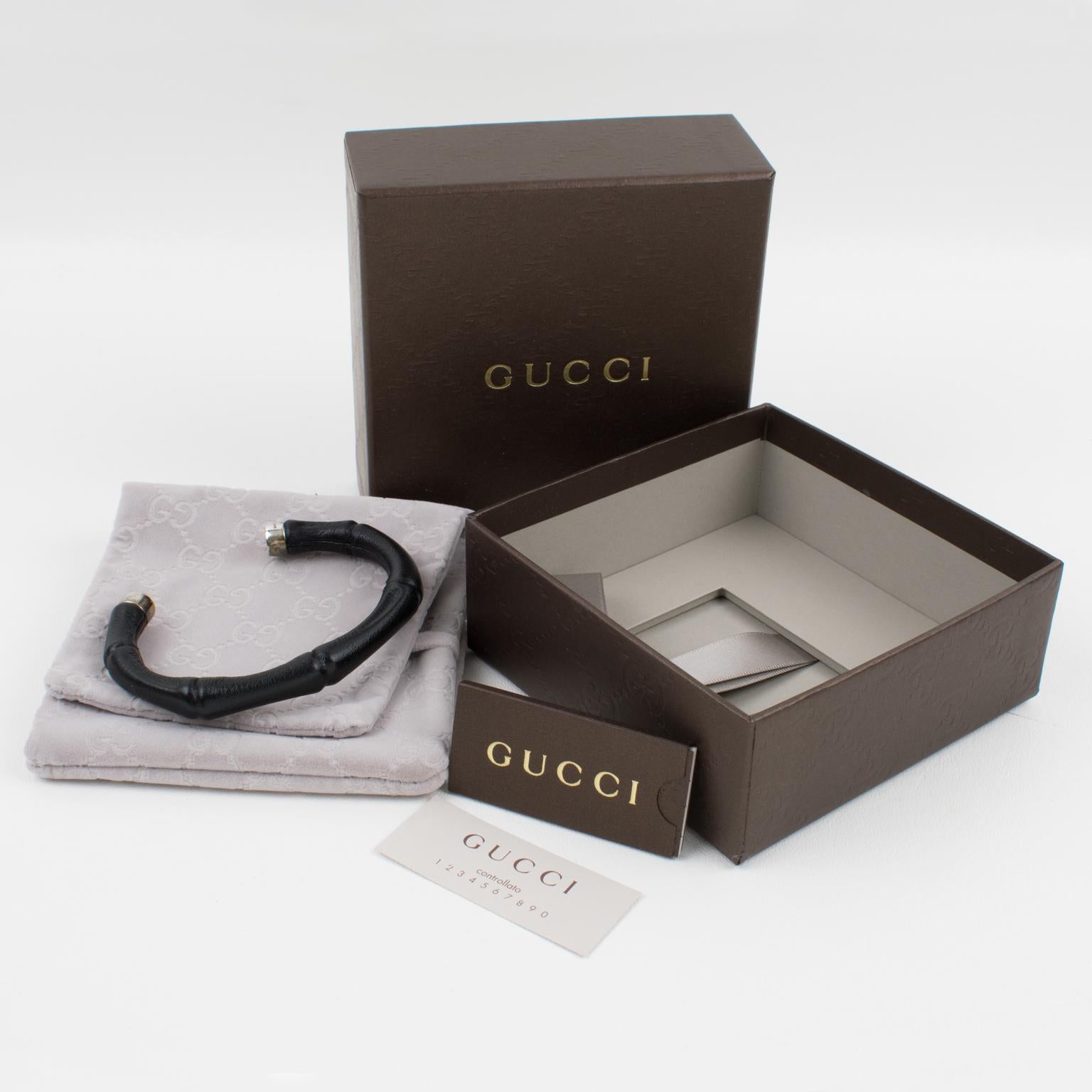 A fabulous cuff bracelet by Gucci featuring the iconic bamboo motif in black leather and sterling silver 925. The bamboo design has been a classic in the Gucci Collection, prompting an exhibition dedicated to it and named 