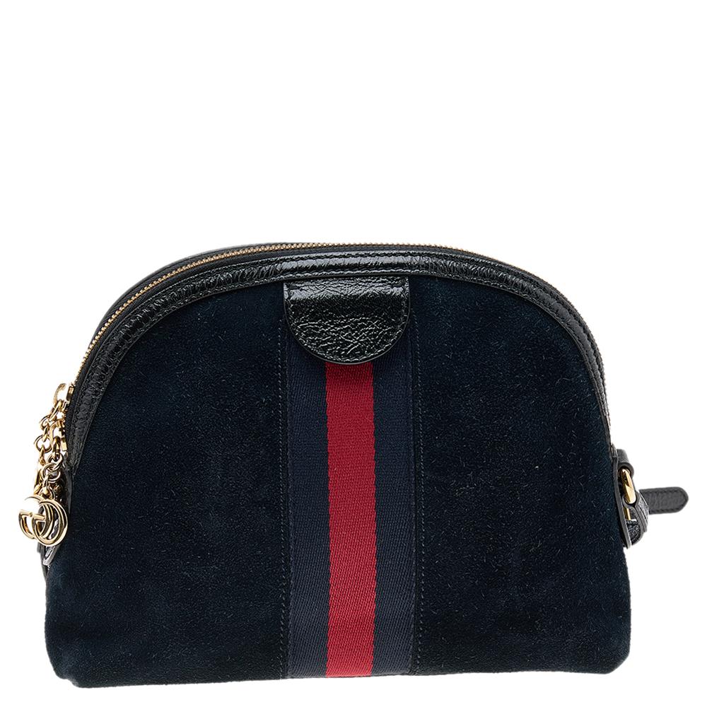 Stacked with signatory elements of the House, this Ophidia crossbody bag from Gucci will bring iconic excellence to your style. It is made from suede and leather, with gold-toned GG motifs perched on the front and dragon embroideries. A Web Stripe