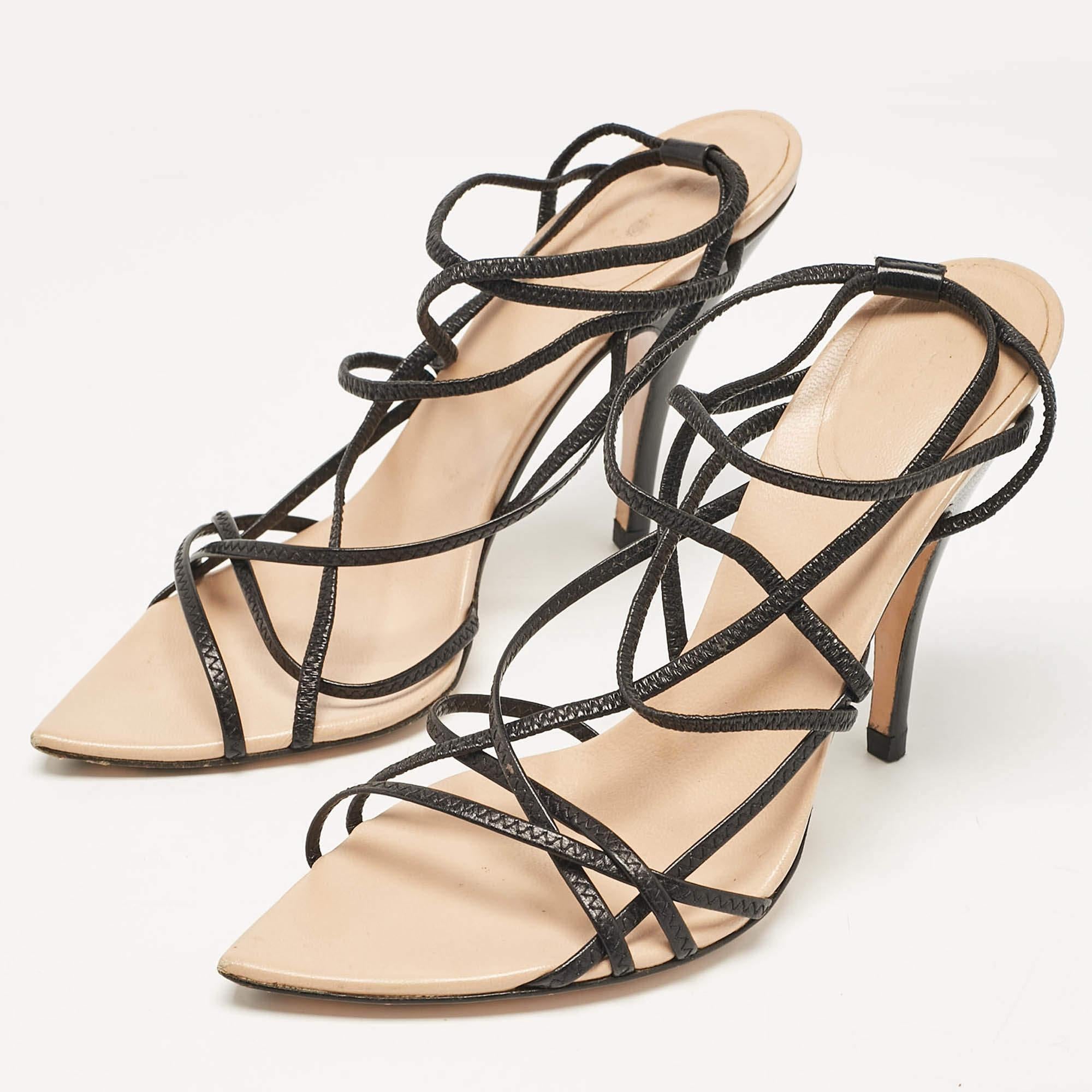 These Gucci black sandals will frame your feet in an elegant manner. Crafted from quality materials  they have a strappy layout and 11 cm heels.