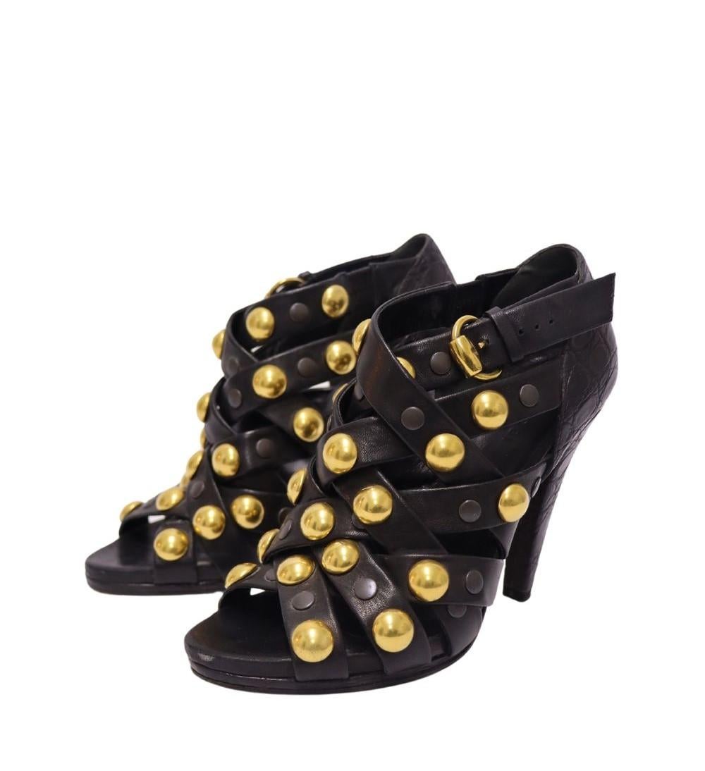 Gucci Black Leather Babouska Crisscross Booties, features an open toe, gold embellishments, buckle fastening, crisscross straps and block heels.

Material: Leather 
Size: EU 37
Heel: 11.5cm
Overall Condition: Good
Interior Condition: Signs of
