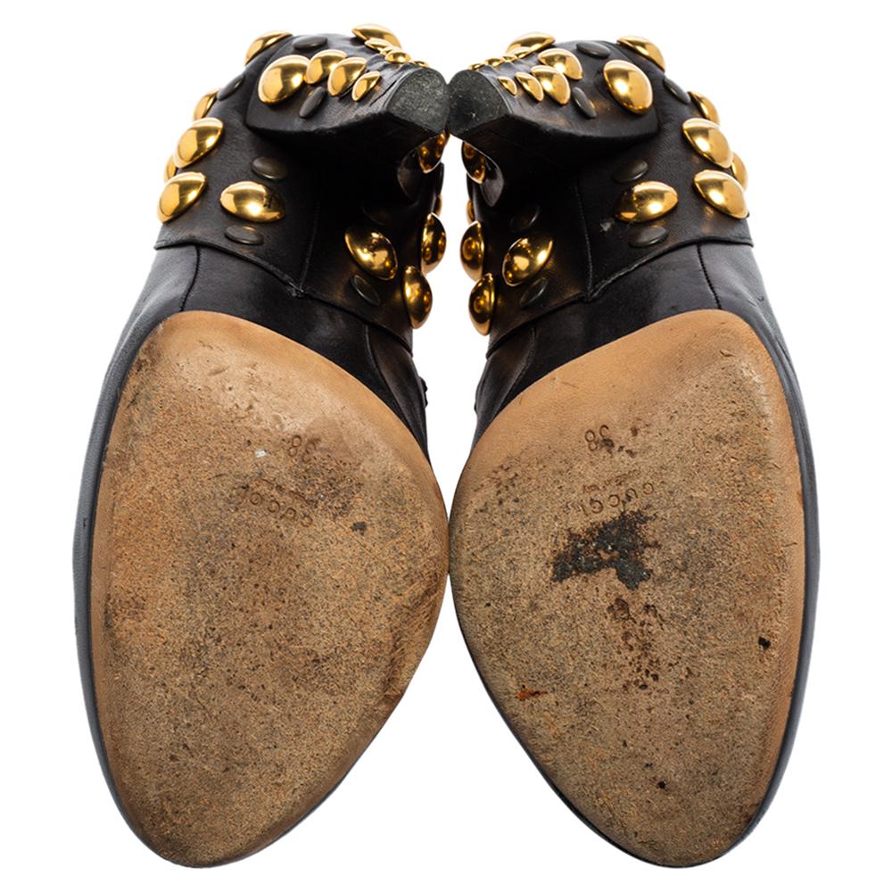 Coming from the House of Gucci, these Babouska booties are made to offer style and elegance effortlessly. They are made using black leather on the exterior with delicate gold-toned stud embellishments adorning their counters and heels. Look