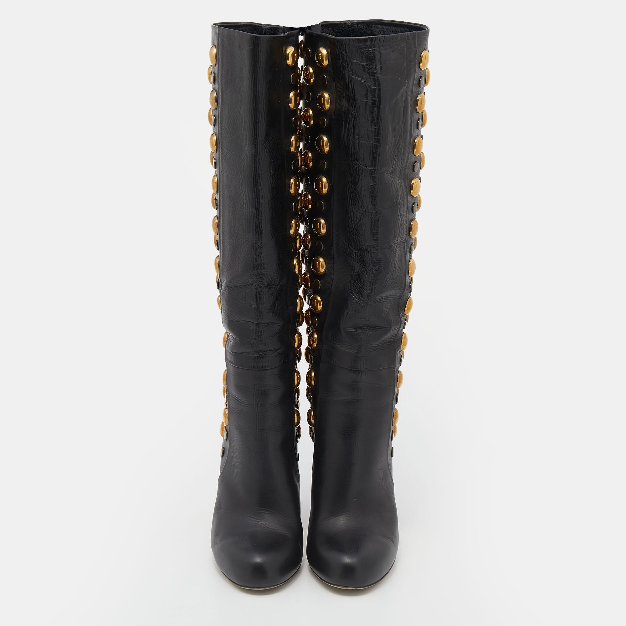 Gucci brings you these gorgeous mid-calf boots that will look amazing with midi skirts and dresses. They've been crafted from black leather and flaunt stylish gold-tone studs. Comfy insoles and 11 cm heels finish off the beauties.

Includes: