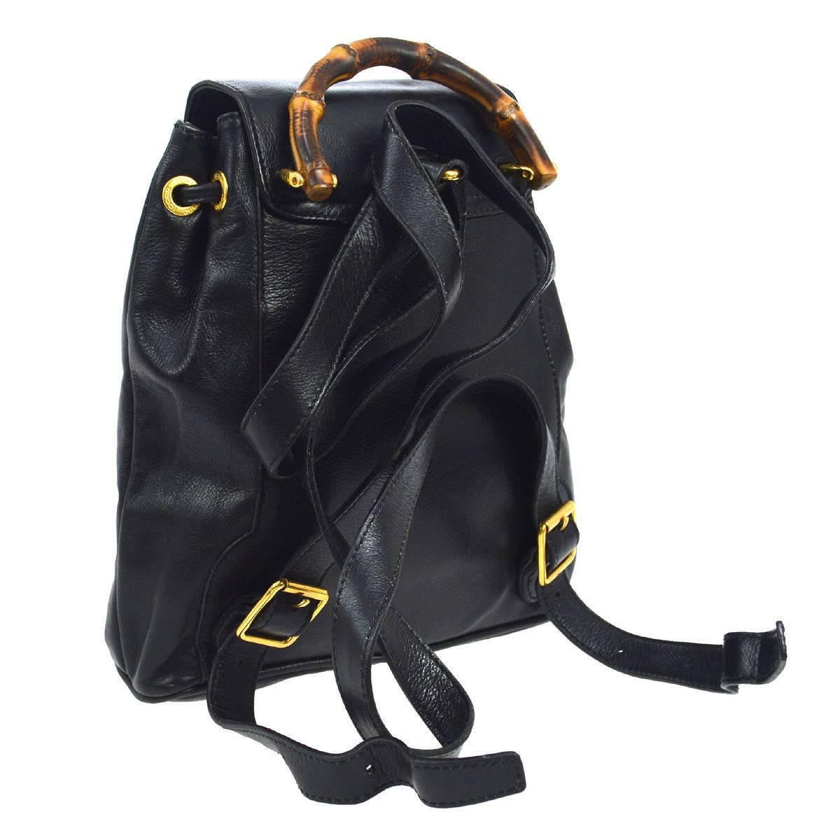 Gucci Black Leather Bamboo Men's Women's 2 in 1 Top Handle Satchel Shoulder Backpack Bag

Leather
Bamboo
gold tone hardware
Woven lining
Drawstring closure 
Made in Italy
Adjustable straps 23-29