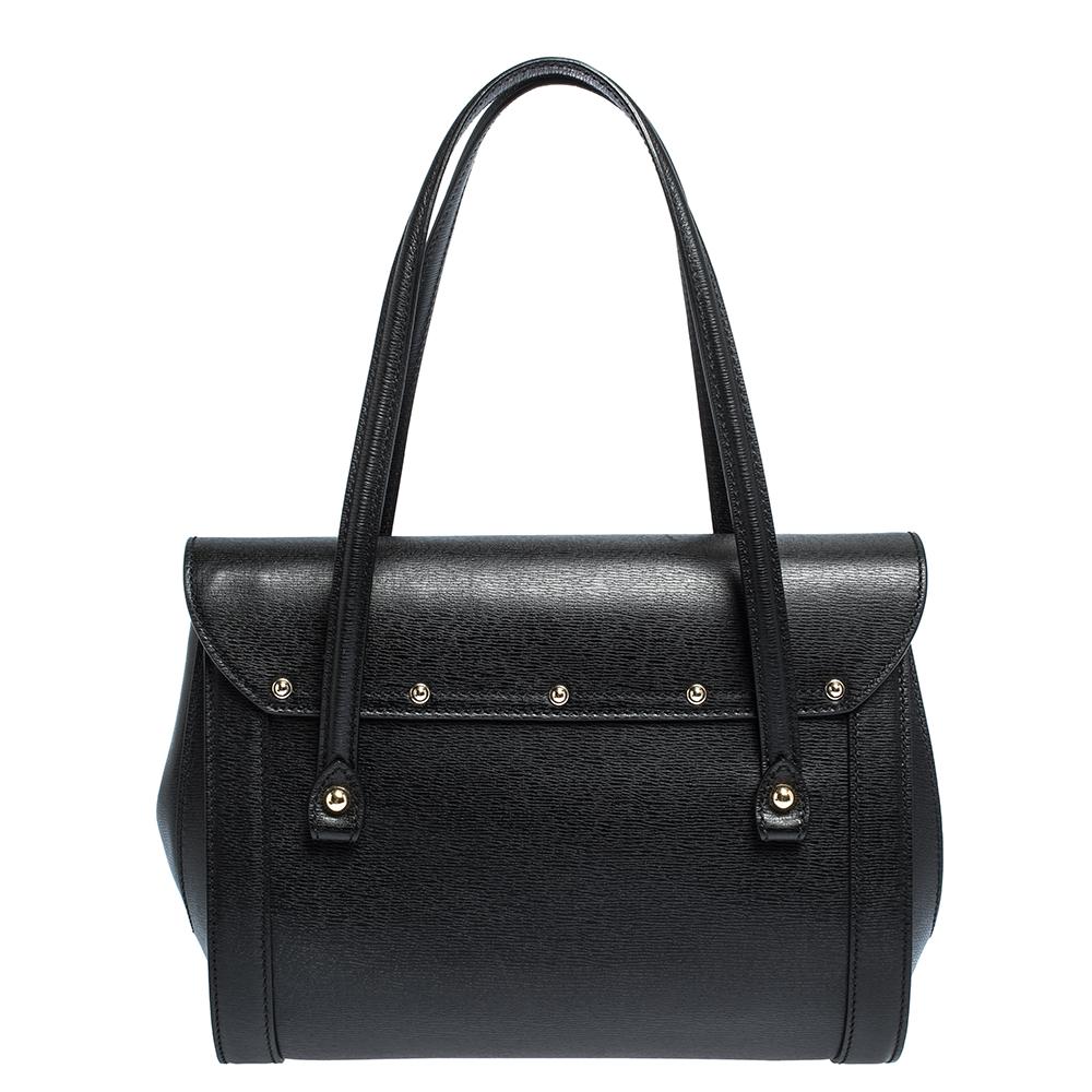 Bags from Gucci are on every woman's wishlist. So, own this gorgeous Bamboo Bullet satchel today and light up your closet! Crafted from leather, this stunning black number has a front flap-over closure and opens to a fabric-lined interior. It