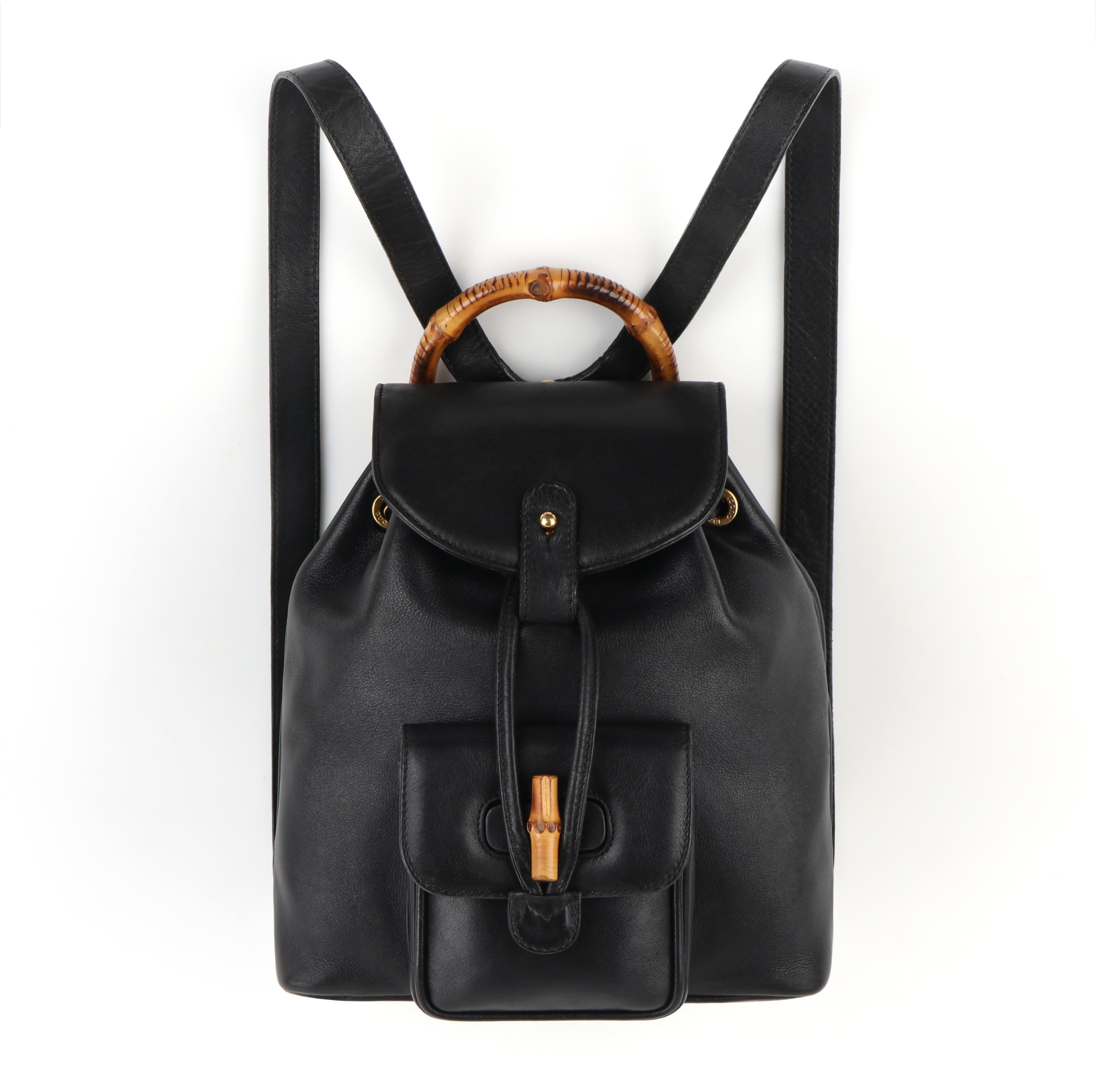 GUCCI Black Leather Bamboo Handle Mini Drawstring Backpack Handbag - Vintage

Estimated Retail: $1,250.00
 
Labels: Gucci 
Style: Backpack
Color(s): Black
Lined: Yes
Unmarked Fabric Content (feel of): Leather (exterior)
Additional Details /