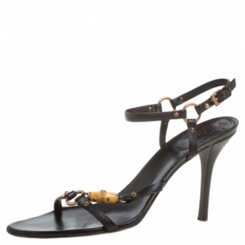 These classic sandals by Gucci are a closet staple for any fashionista. Crafted from leather, they feature the signature bamboo detailing adorned with tassels. The sandals are elevated on 10.5 cm heels and offer open-toes.