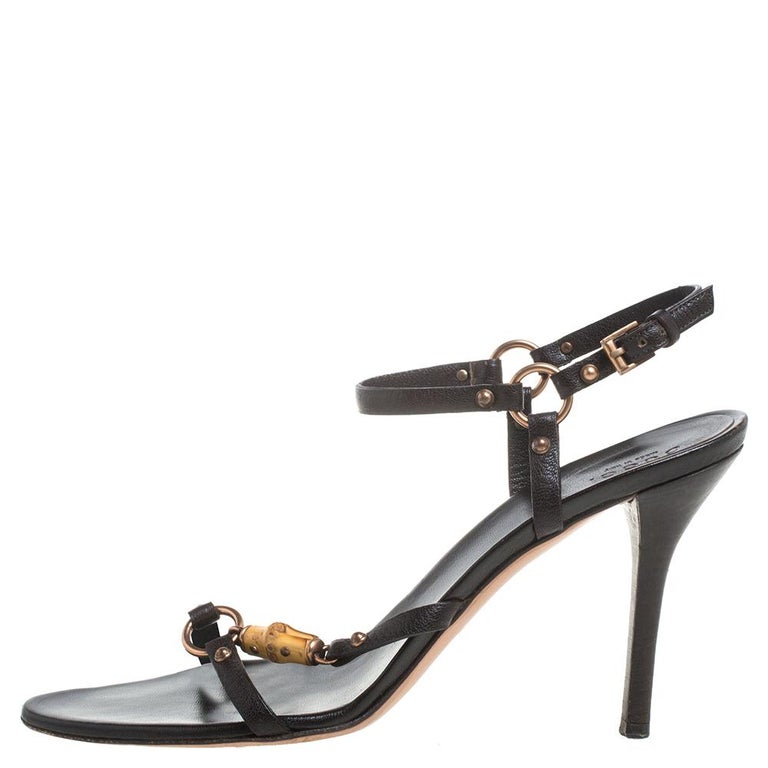 These classic sandals by Gucci are a closet staple for any fashionista. Crafted from leather, they feature the signature bamboo detailing adorned with tassels. The sandals are elevated on 10.5 cm heels and offer open-toes.

