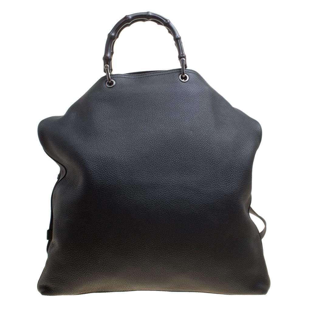 Handbags as fabulous as this one are hard to come by. Crafted from black leather, this stunning number features two bamboo handles and a detachable shoulder strap. The spacious suede interior will safely hold your necessities. The bag is a creation