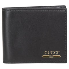 Portafoglio Bifold Logo Stamp di Gucci in pelle nera