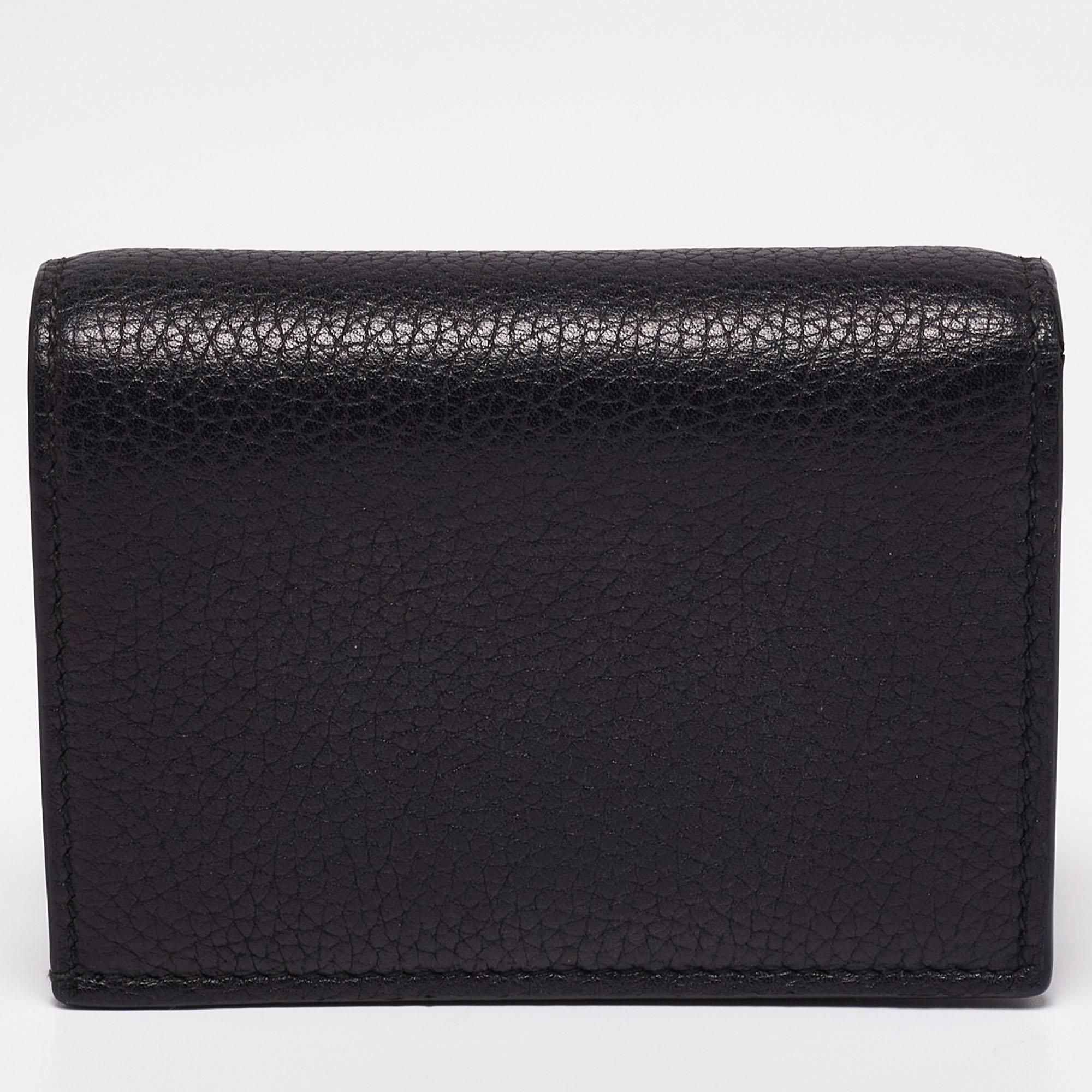 This wallet from Gucci is aesthetically pleasing and chic. It showcases a black leather exterior, with a gold-toned Bee accent and a 