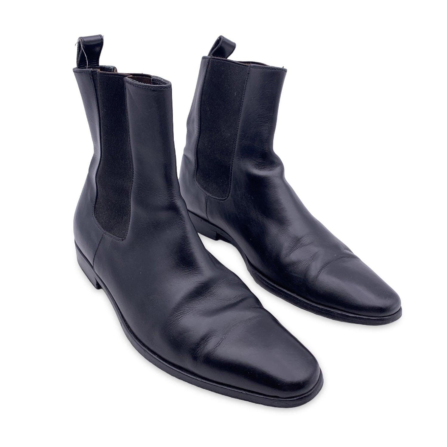 Black leather chealse boots by GUCCI designed with a pointed toe. Leather outsoles. Elastic leather strips for a flexible fit. Pull tab at ankleMade in Italy. Size: 40.5 (The size shown for this item is the size indicated by the designer on the