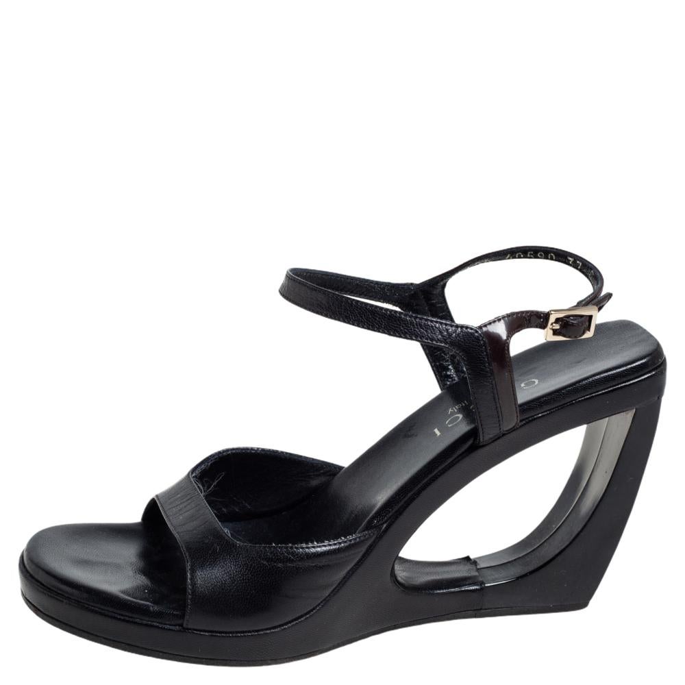 These fabulous leather sandals from Gucci have been designed to lift your style. They flaunt open toes, well-cut vamps, and 10 cm wedge hollowed-out heels. Pair them with a dress for a fashionable brunch and get set to win a lot of compliments.

