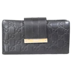 Gucci Black Leather Embossed Monogram Wallet
